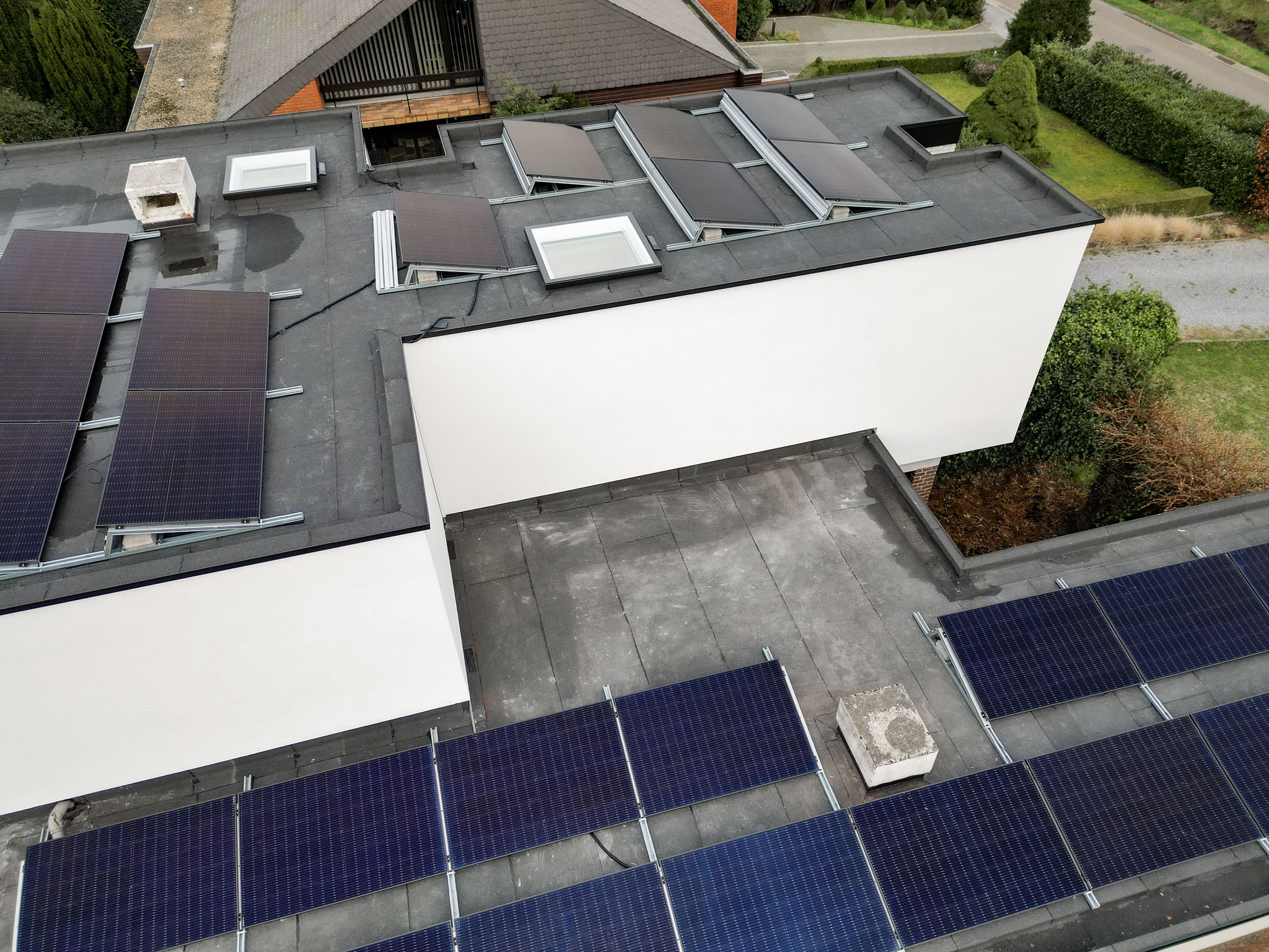 Platte dak en gevelrenovatie in Alken