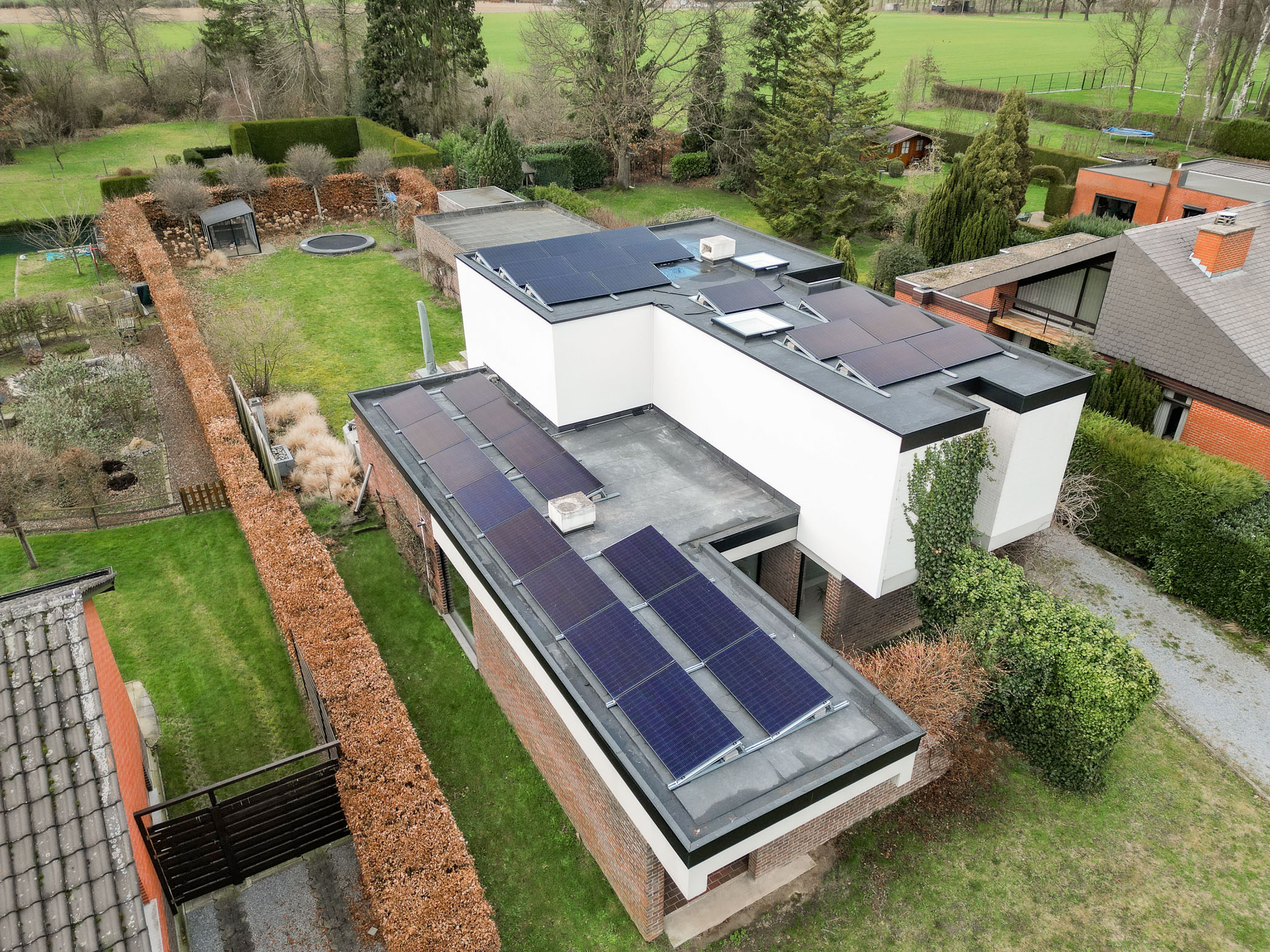 Platte dak en gevelrenovatie in Alken