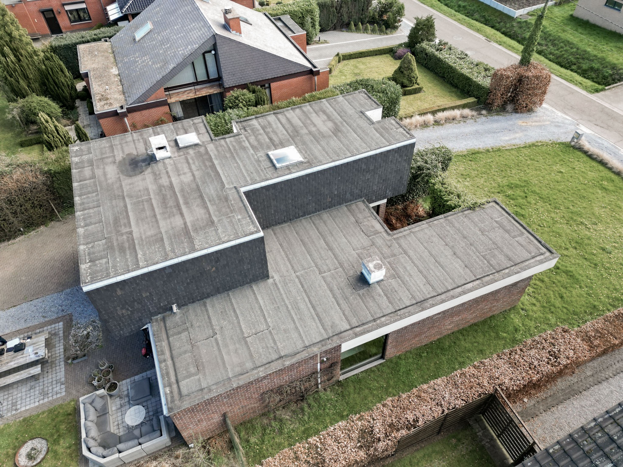 Platte dak en gevelrenovatie in Alken